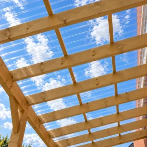 Clear CorruTuf polycarbonate roofing sheet showing the rounded 76/18 corrugated profile